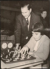 Load image into Gallery viewer, Black and white press photo with a picture of Paul Keres and Nona Gaprindashvili

